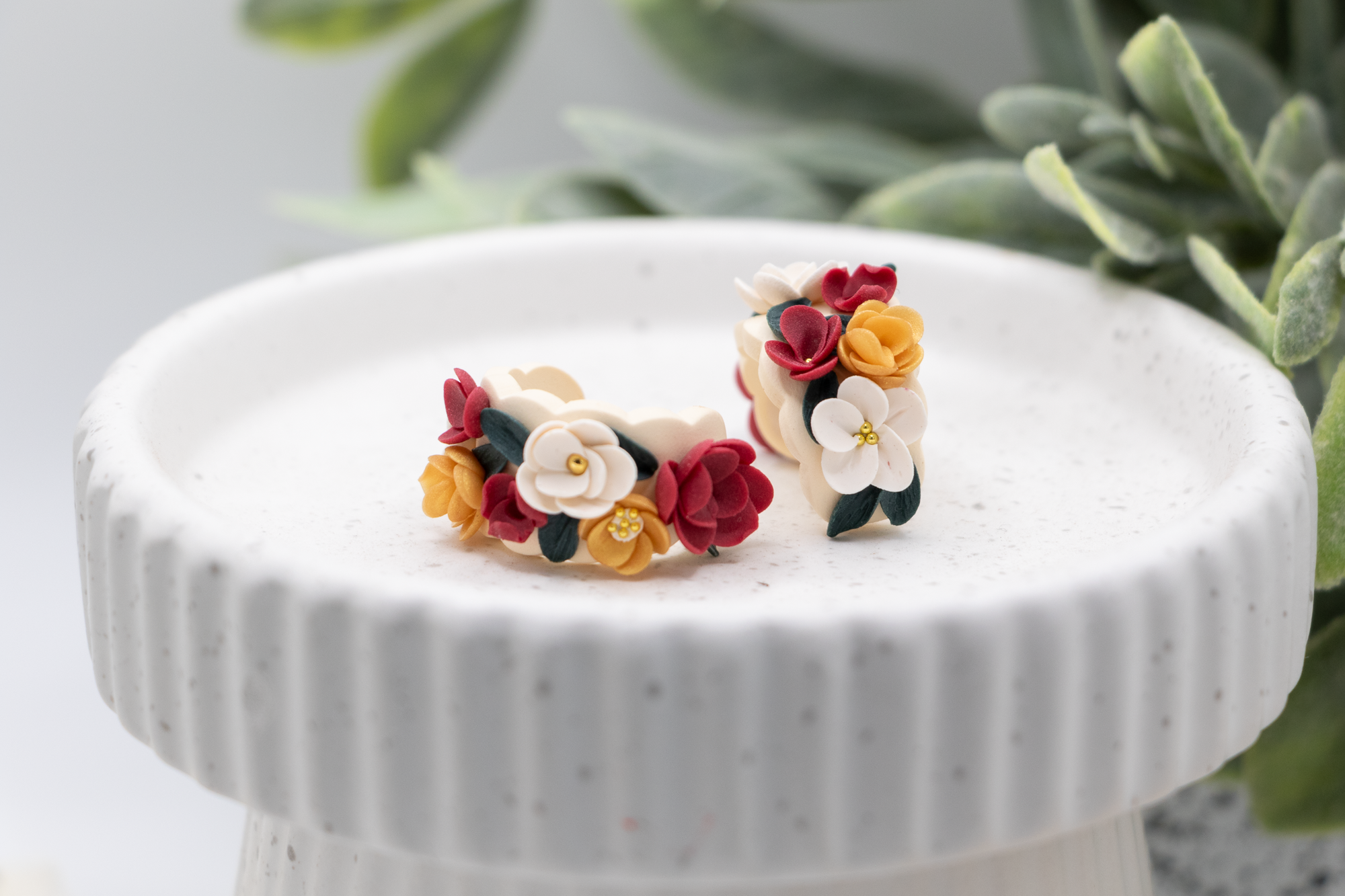 Flower huggie earrings