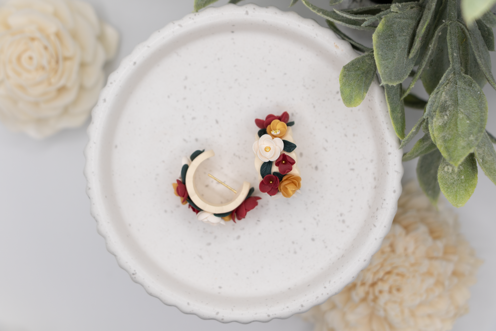Flower huggie earrings