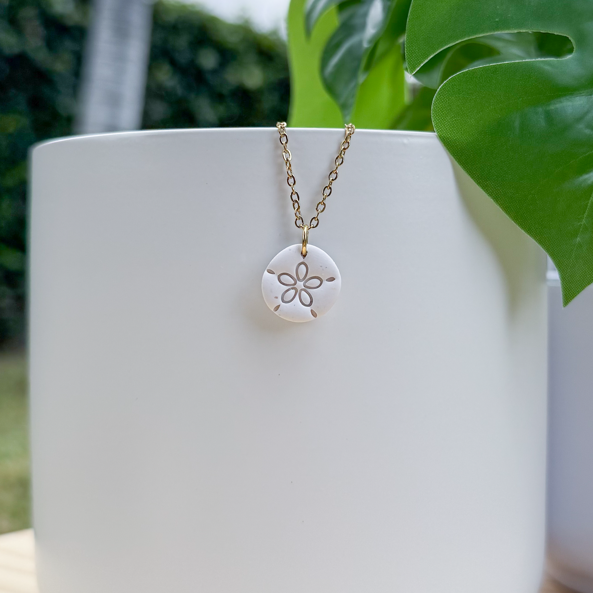 Sand dollar charm necklace